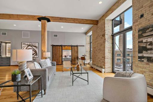 Home features balconies off the living room and primary bedroom.