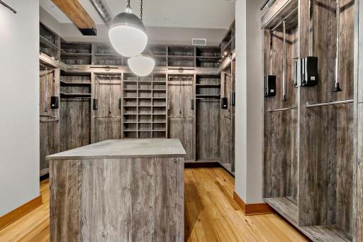 Custom primary closet with expansive space and storage options.