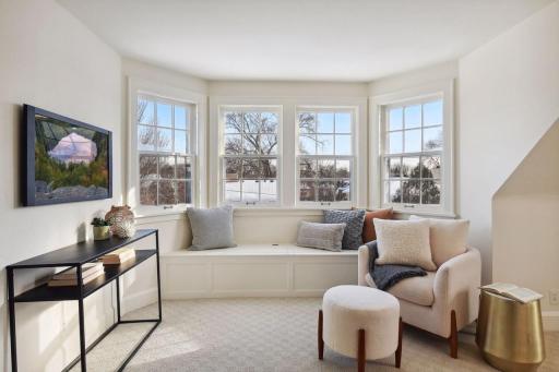 Cozy corner of the primary suite has commanding views of the neighborhood