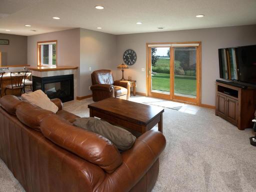 with 3-sided Fireplace that separates the Family Room from...
