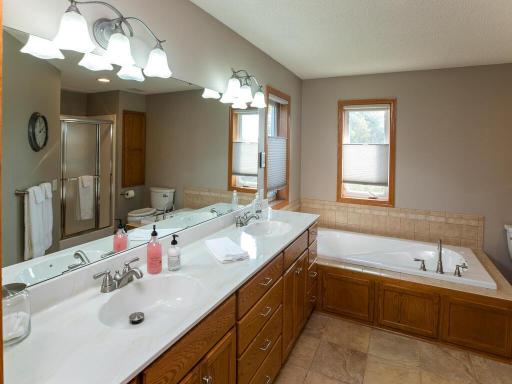 Owner's bathroom has a 36" high vanity with double sinks, jetted tub...