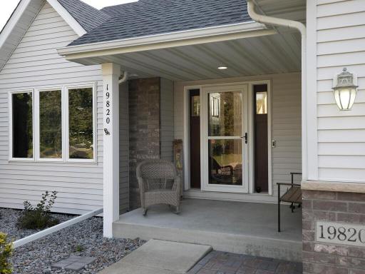 Very inviting and covered front entry welcomes your guests