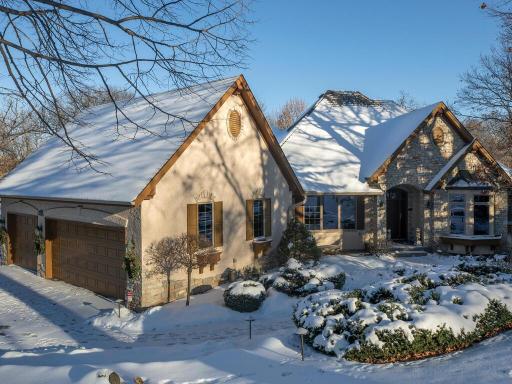 Stunning curb appeal abounds this breathtaking custom rambler.