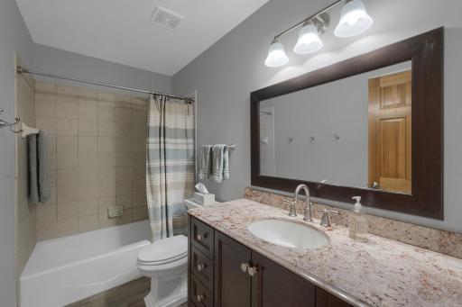 Nicely updated full bathroom is located between the third and fourth bedroom.