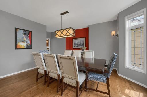 Formal dining room with a large bay window adding additional space, along with newer chandelier and sconces. Also, a perfect nook which provides space for a buffet or china cabinet.