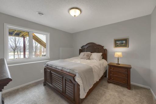 The fifth bedroom on the lower level has a nice view of Saunders Lake.