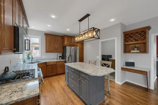 Kitchen features a built in planning desk. Oversized drawers on kitchen island for extra storage!