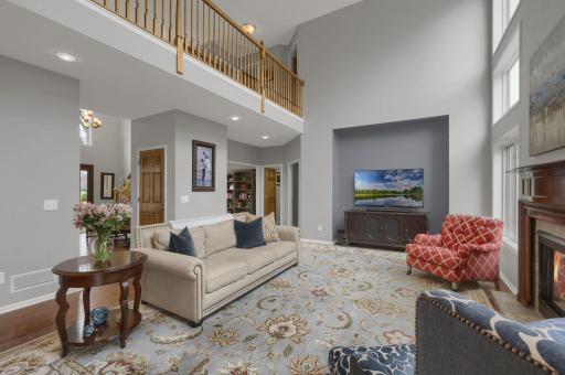The two story foyer flows into the great room with catwalk. Nook on the far wall is great for a media console and large TV.