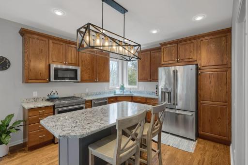Updated lighting and granite countertops, as well as newer stainless appliances. You will love the walk in pantry refinished with a fantastic organizing system.