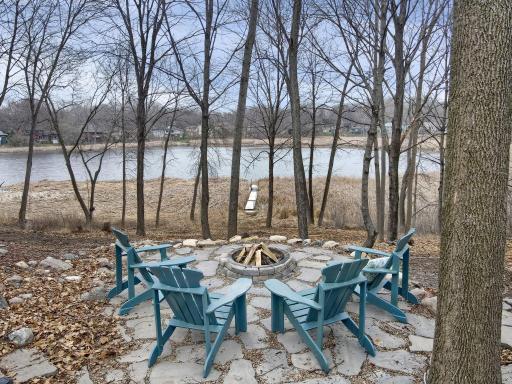 A wonderful fall scene, relax around the fire overlooking the lake.
