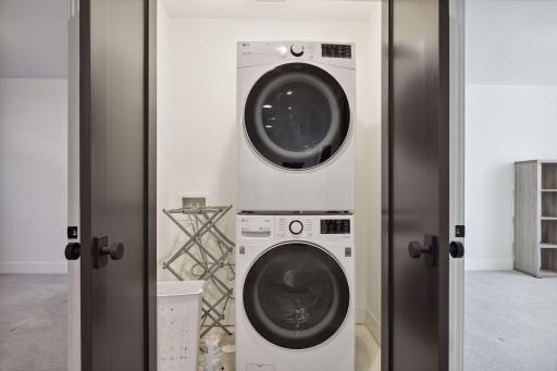 Tucked between the lower level bedroom is a convenient laundry closet.