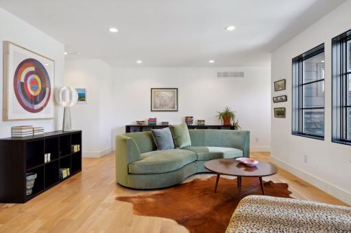 The upper level of the home boasts a spacious Loft with hardwood flooring.