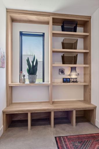 Conveniently located off the garage is the large Mud Room which offers a built-in boot bench with cubbies and shelving along with a coat closet.