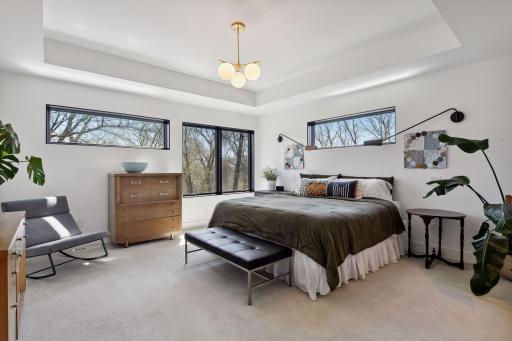 A tranquil retreat, the Primary Suite enjoys unparalleled views of the wetlands.