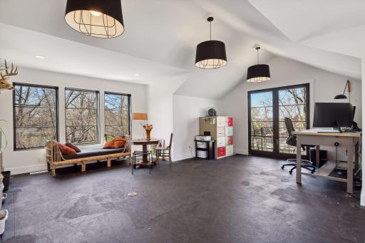 Perched atop the garage is the Bonus Room that is a perfect spot for an art or yoga studio. An adjacent storage space is plumbed for a future bathroom.