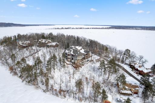 Nestled on 1.19 acres, this custom-built lakeshore home boasts four bedrooms and five bathrooms in the main cabin, with an adjacent two bedroom, two bathroom guest house. The property overlooks 243 feet of pristine Gull Lake shoreline.