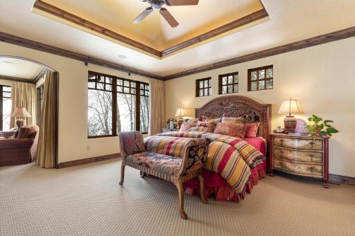 Retreat to the main floor primary suite with a private sitting area and full bathroom.