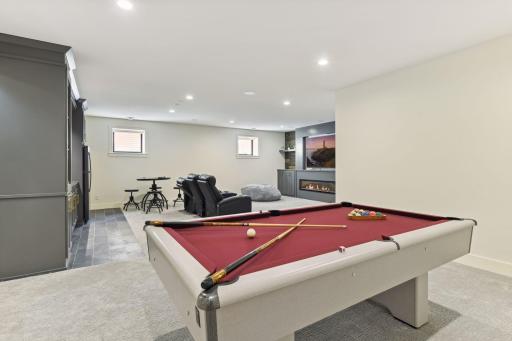 Lower level has plenty of space for pool table, home theater and features tall 9' ceilings.