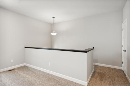 Entry from the foyer with a convenient coat closet. Photos are not of actual home. Actual home will be similar. Some colors and features may vary.