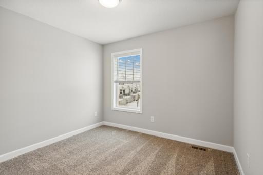 2nd bedroom upstairs. Photos are not of actual home. Actual home will be similar. Some colors and features may vary.