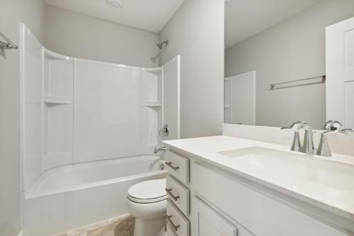 Full bath in the upstairs. Photos are not of actual home. Actual home will be similar. Some colors and features may vary.