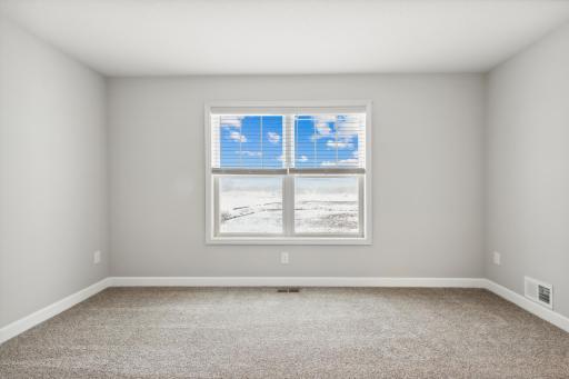 Large owner's suite with private bath. Photos are not of actual home. Actual home will be similar. Some colors and features may vary.