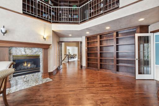 Note the upper library area plus another fireplace too