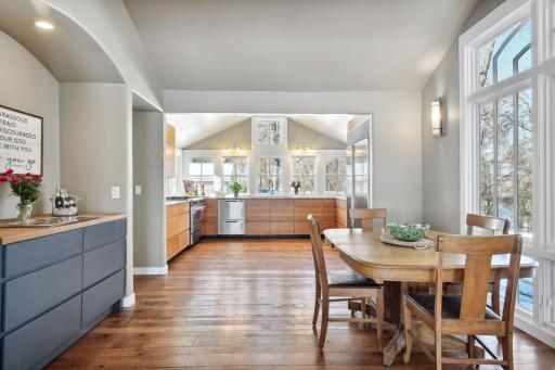A butcher block island on wheels provides ease and convenience in the kitchen for added convenience.