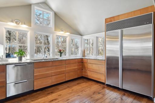 The kitchen is equipped with a Fisher Paykel double drawer dishwasher, and Subzero SS refrigerator plus a new SS 3-section sink.