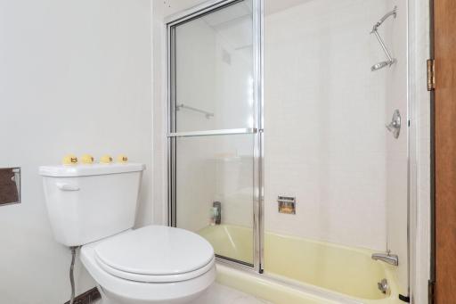 One of two lower level bedrooms with a private, full bathroom and private patio access.