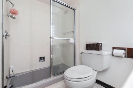 The second of two lower level bedrooms with a private, full bathroom and private patio access.
