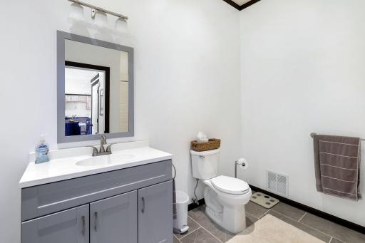 The main floor, mother-in-law suite features its own private entrance, a workout space, a kitchen, a bedroom, a full bathroom and heating and cooling controlled separately from the main house.