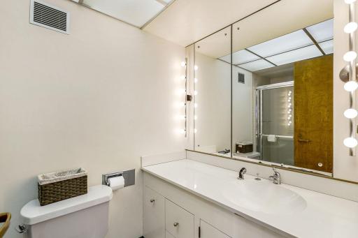 The second of two lower level bedrooms with a private, full bathroom and private patio access.
