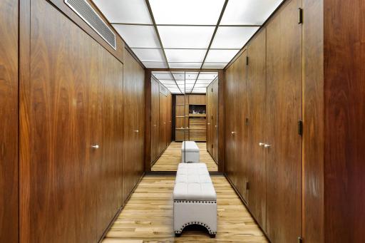 The primary bathroom features a spacious double vanity with built in storage, a separate soaking tub, a large walk-in shower and leads into the generous walk-in closet.