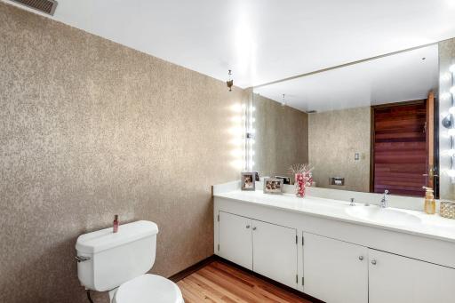 Off the front and garage entry you will find 2 spacious closets for storage and a half bathroom.