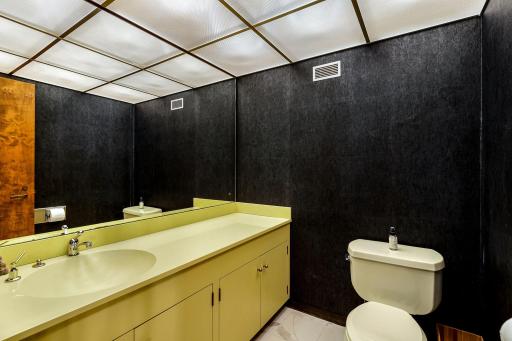The lower level is serviced by a spacious half bathroom.