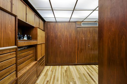 The primary bathroom features a spacious double vanity with built in storage, a separate soaking tub, a large walk-in shower and leads into the generous walk-in closet.