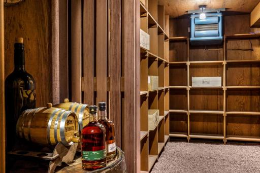 The generous wine cellar offers abundant space for wine and spirit collections.