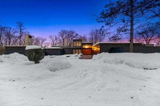This recently restored, Frank Lloyd Wright inspired, mid-century modern masterfully integrates with its 10+ acre setting along the shores of a private, recreational lake (known for its privacy and great fishing).