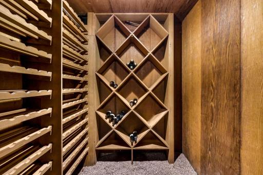 The generous wine cellar offers abundant space for wine and spirit collections.