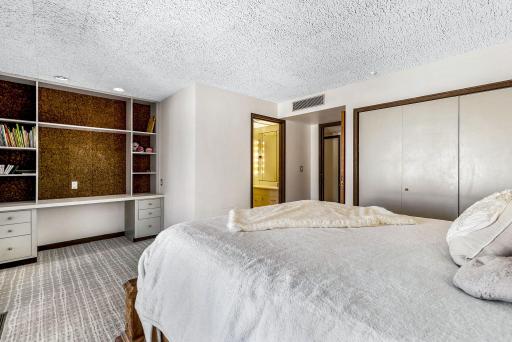 The second of two lower level bedrooms with a private, full bathroom and private patio access.