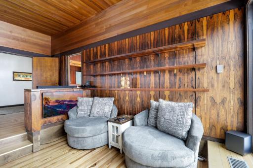 The sunk in reading nook walks out to another patio space.