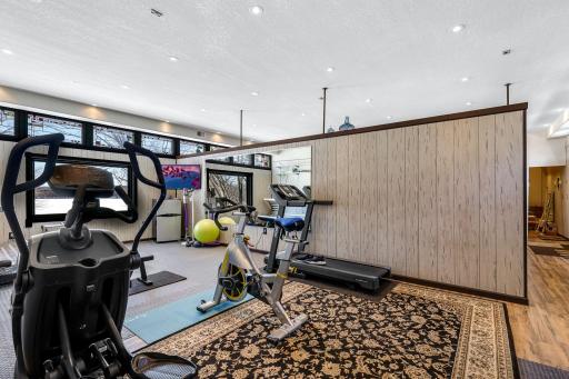 The main floor, mother-in-law suite features its own private entrance, a workout space, a kitchen, a bedroom, a full bathroom and heating and cooling controlled separately from the main house.