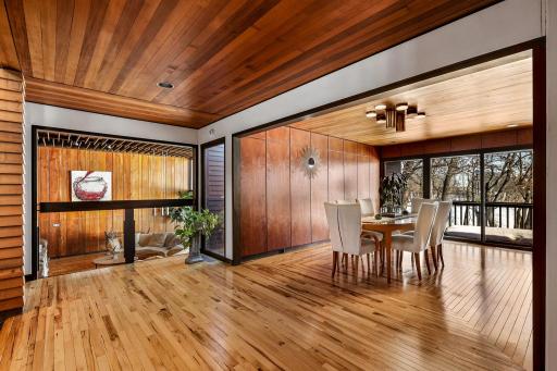 The bright and open formal dining space features a custom designed Hickory floor and a stunning bar/buffet for entertaining.