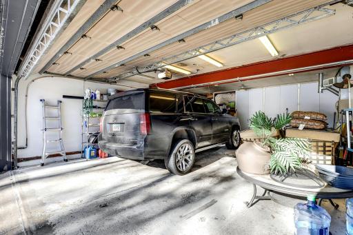 The 4-car, insulated, heated and cooled garage offers an entire back wall of storage cabinets.