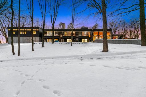 This recently restored, Frank Lloyd Wright inspired, mid-century modern masterfully integrates with its 10+ acre setting along the shores of a private, recreational lake (known for its privacy and great fishing).