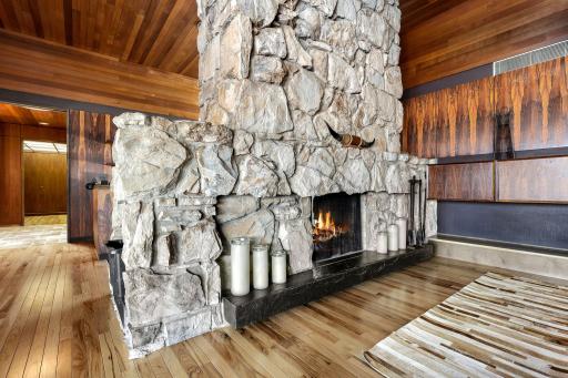 Enjoy the warmth of the double sided, stone fireplace.
