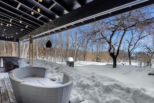 The primary suite walks out to multiple covered patio spaces.