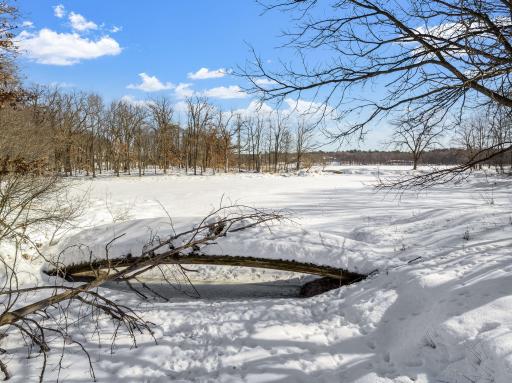 This rare 10+ acre plot of land features a range of usable elevations with incredible views, more than 1,000' of waterfront, a private beach & lagoon for fishing, multiple patio spaces and a limestone road to transport you to it all by ATV.