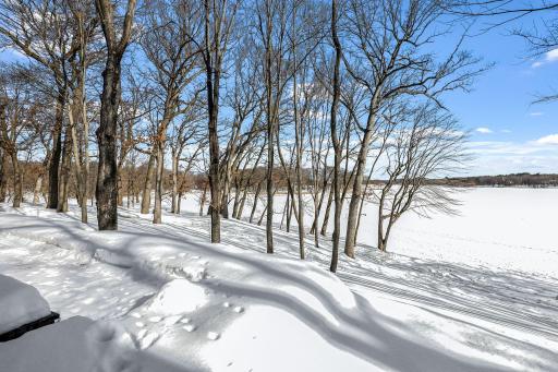 This rare 10+ acre plot of land features a range of usable elevations with incredible views, more than 1,000' of waterfront, a private beach & lagoon for fishing, multiple patio spaces and a limestone road to transport you to it all by ATV.
